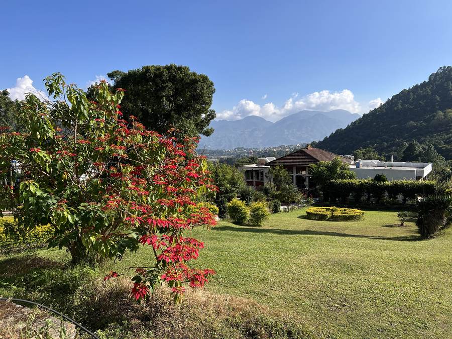 Lawns and gardens with the Kathmandu Valley hills behind