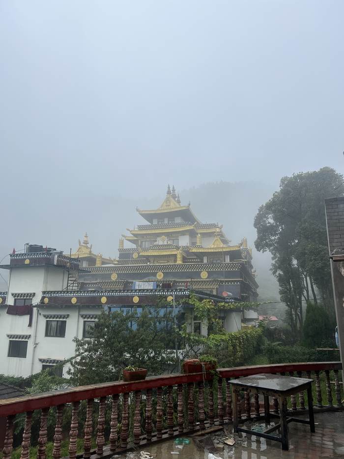 Monastery roofs in monsoon fog